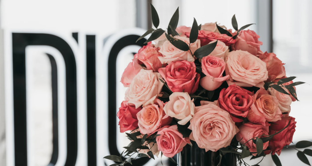 Roses and foliage greens in a vase